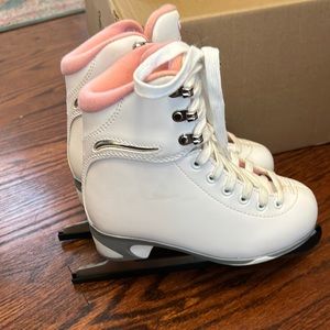 Girls size 1 ice skates with blade covers.